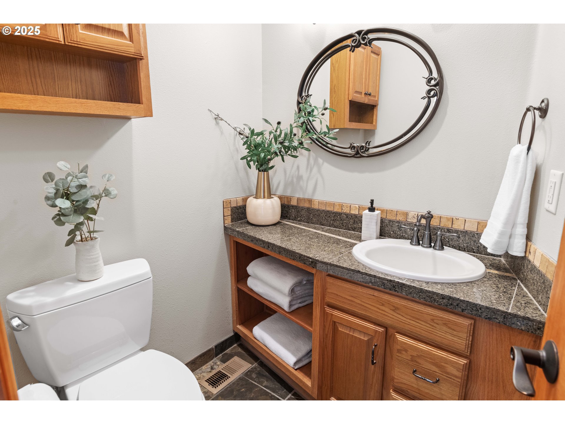 260 Round House Road Astoria, OR 97103 - Photo 10 of 37 a bathroom with a toilet a sink and a mirror