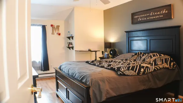 a room with gym equipment and view of living room