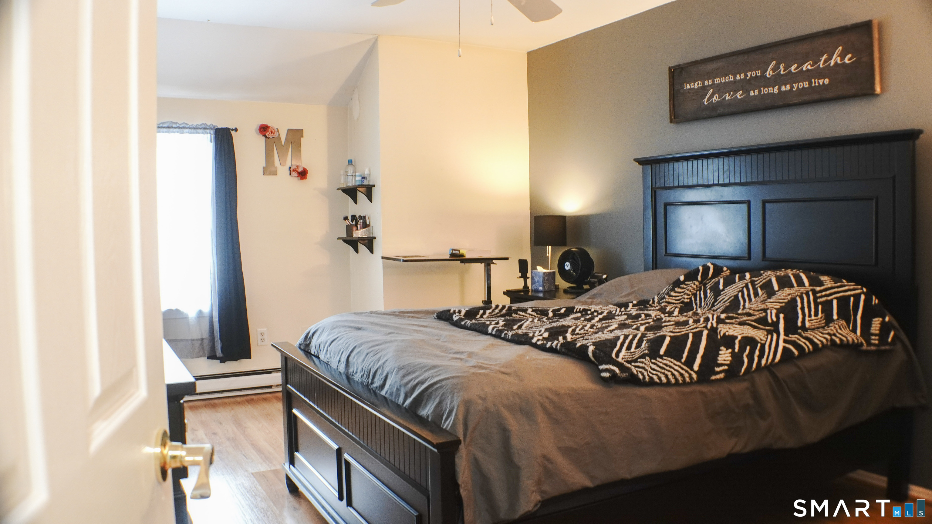 14 Scuppo Road, Unit F3 Danbury, CT 06811 - Photo 7 of 10 a bed sitting in a bedroom next to a window with a lamp