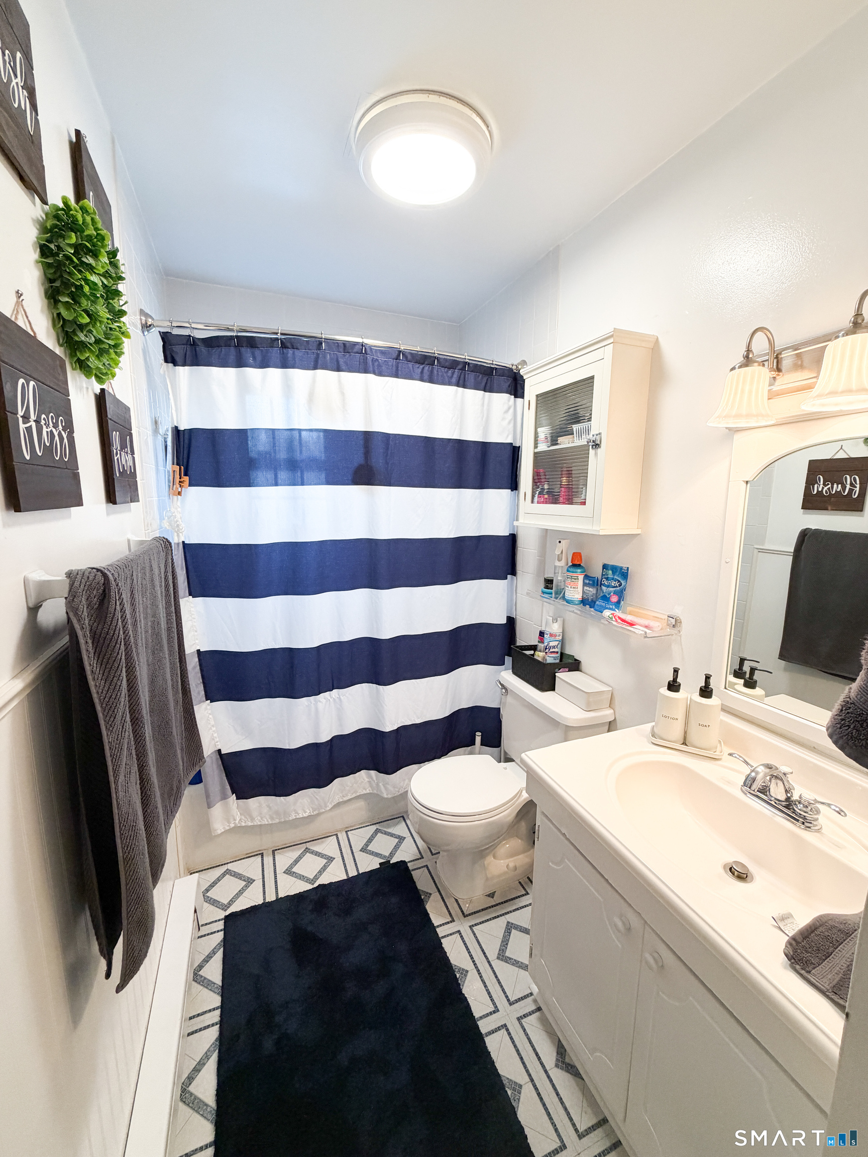 14 Scuppo Road, Unit F3 Danbury, CT 06811 - Photo 9 of 10 a bathroom with a sink a toilet and shower