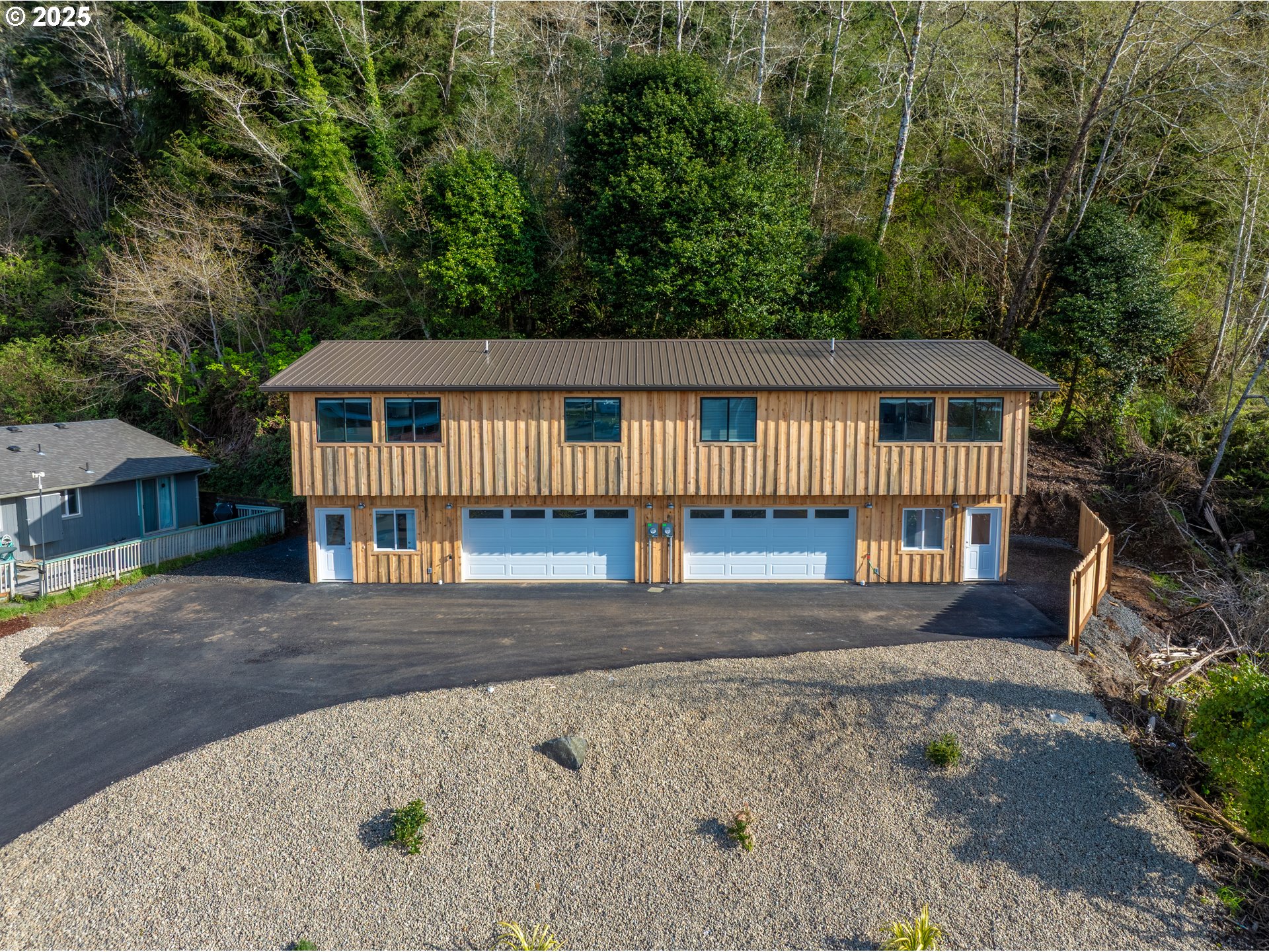 680-682 Elm Avenue Reedsport, OR 97467 - Photo 14 of 36 front view of a house with a yard