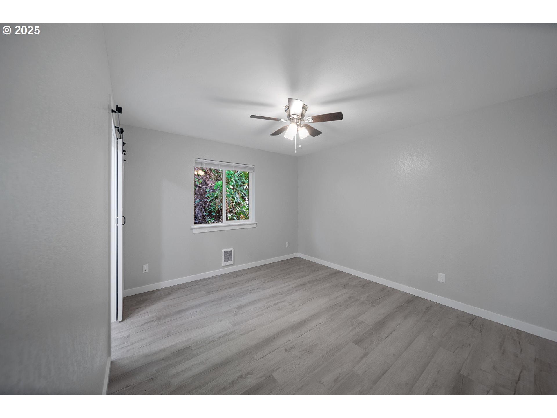 680-682 Elm Avenue Reedsport, OR 97467 - Photo 24 of 36 a view of an empty room with a window
