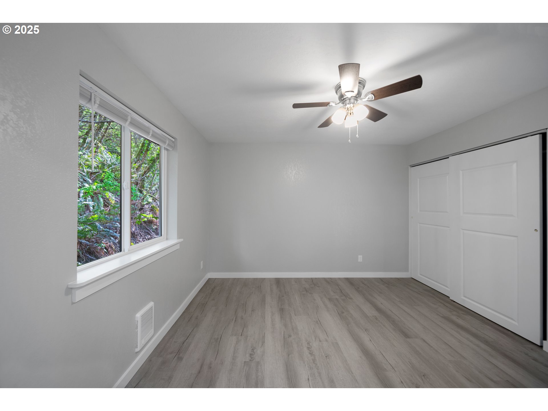 680-682 Elm Avenue Reedsport, OR 97467 - Photo 25 of 36 a view of an empty room with a window