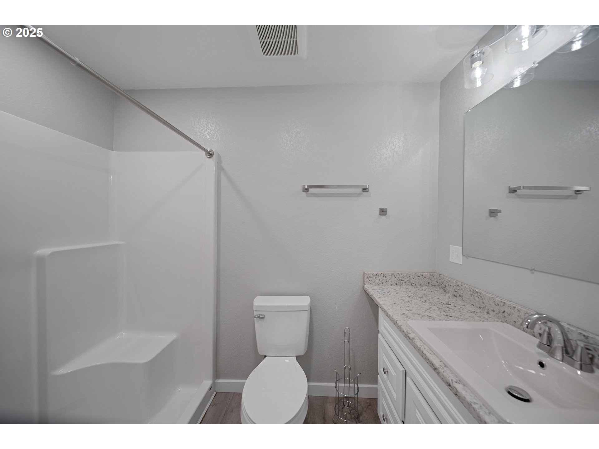 680-682 Elm Avenue Reedsport, OR 97467 - Photo 28 of 36 a bathroom with a granite countertop sink a toilet and shower