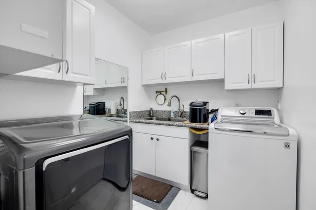 a bathroom with a sink mirror and toilet