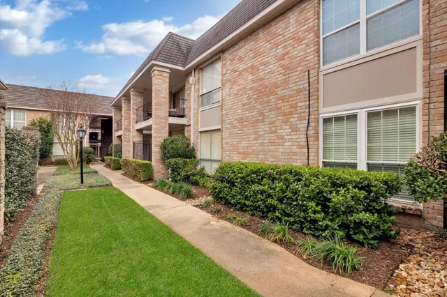 an aerial view of residential houses with yard