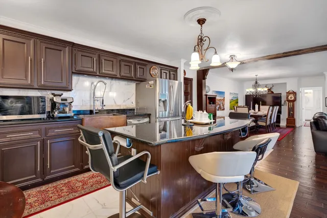 a view of a kitchen and dining room
