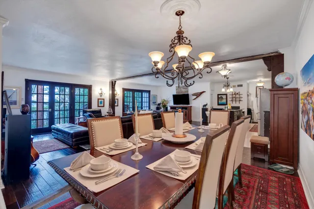 a bedroom with furniture and a flat screen tv