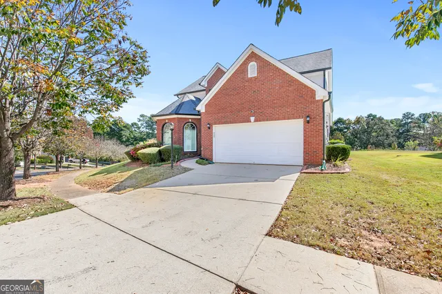 a front view of house with garden
