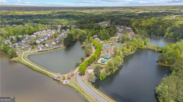an aerial view of a house with a lake view
