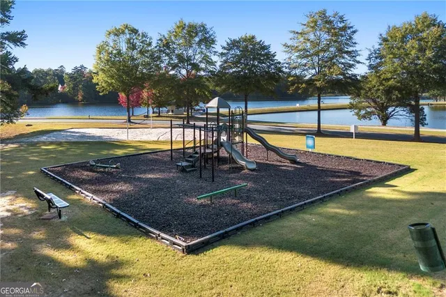 a view of a swimming pool with an outdoor seating