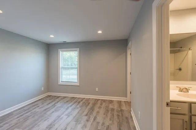 a view of an empty room and a window