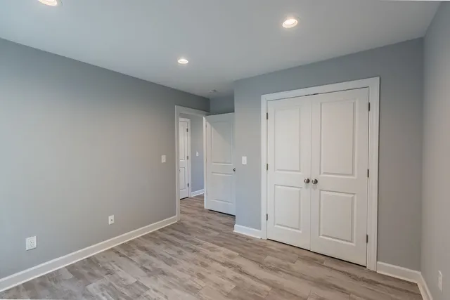 a view of an empty room and wooden floor