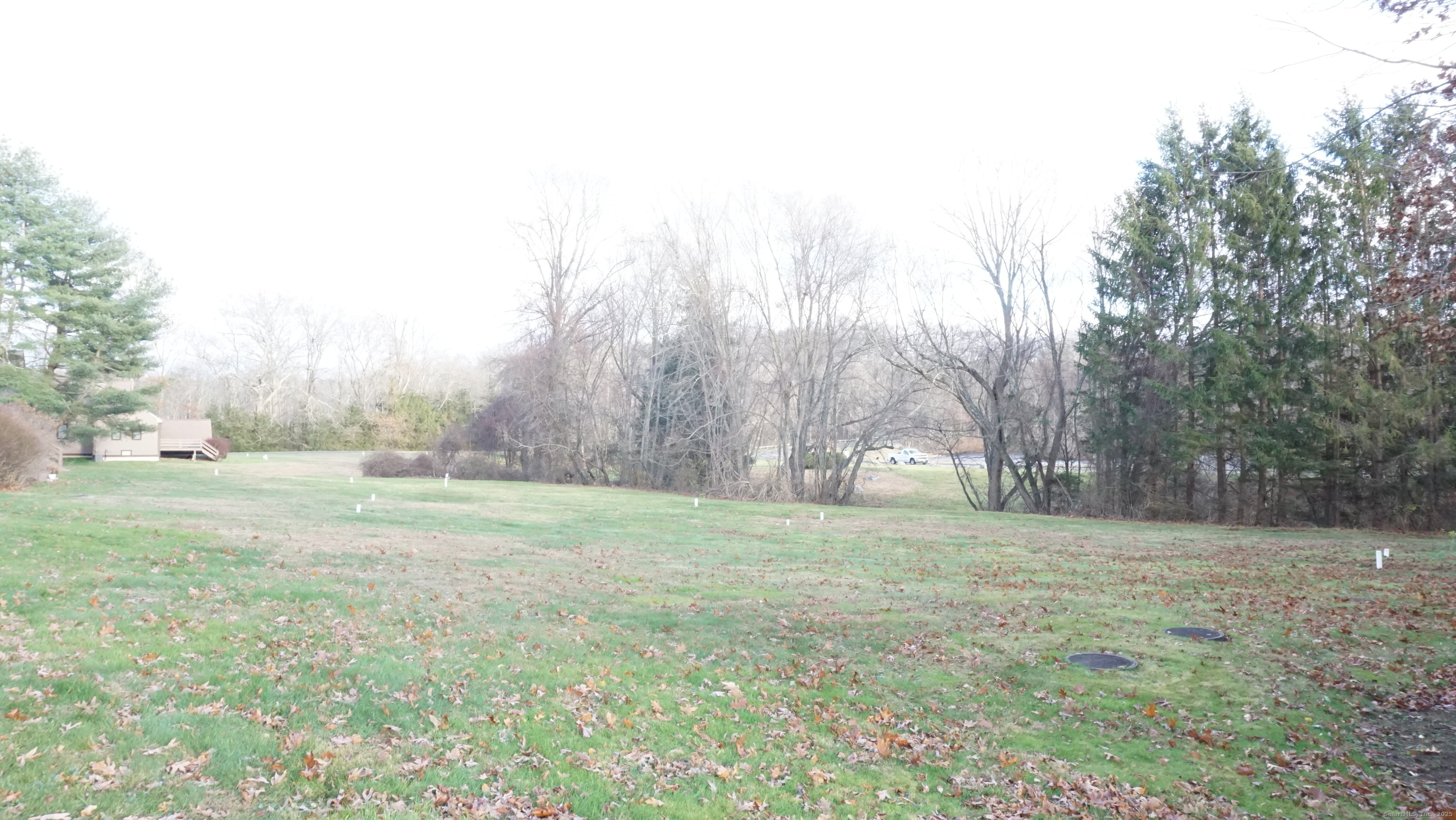 24 Overlook Drive, Unit 24 Monroe, CT 06468 - Photo 31 of 32 a view of a field with trees in the background