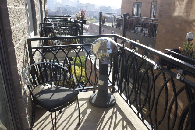 1201 West Adams Street, Unit 709 Chicago, IL 60607 - Photo 12 of 16 a view of a balcony with furniture