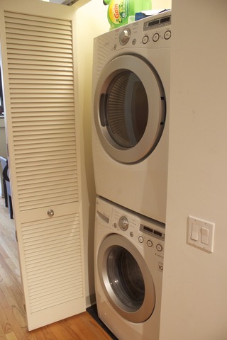 1201 West Adams Street, Unit 709 Chicago, IL 60607 - Photo 14 of 16 a utility room with dryer and washer