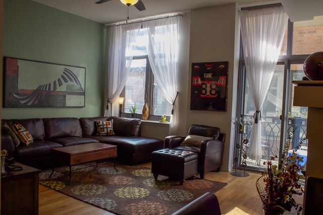 1201 West Adams Street, Unit 709 Chicago, IL 60607 - Photo 2 of 16 a living room with furniture and a window