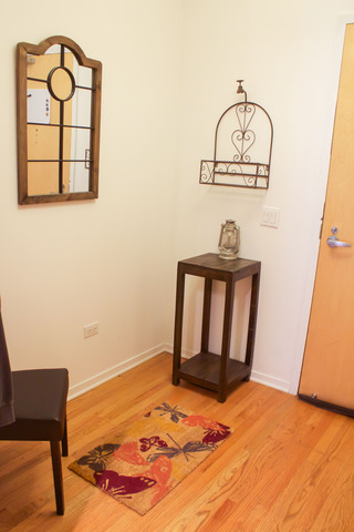 1201 West Adams Street, Unit 709 Chicago, IL 60607 - Photo 9 of 16 a view of a livingroom with wooden floor