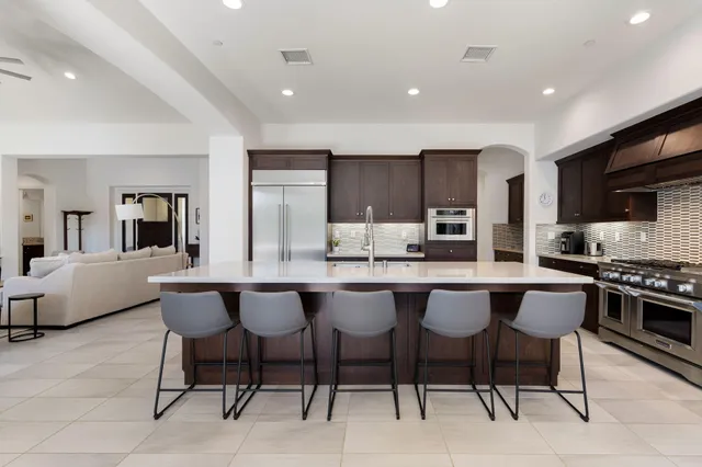 a white bath tub sitting in a bathroom next to a window