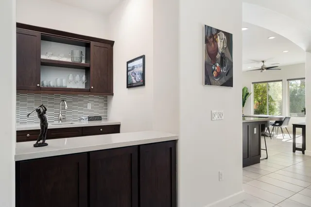 a outdoor space with patio the couches and a fireplace