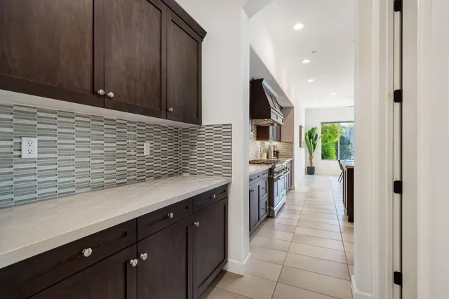 an entrance to house with yard and green space