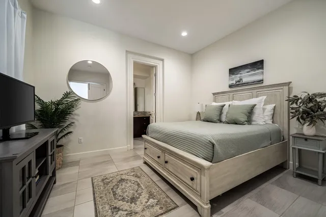 a view of a house with wooden deck