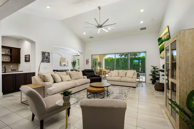 a living room with fireplace furniture and a flat screen tv
