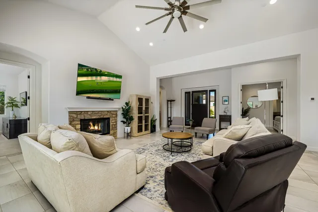a kitchen with kitchen island a sink and a stove