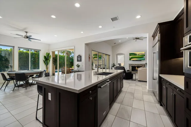 a bedroom with a balcony a bed and a flat screen tv