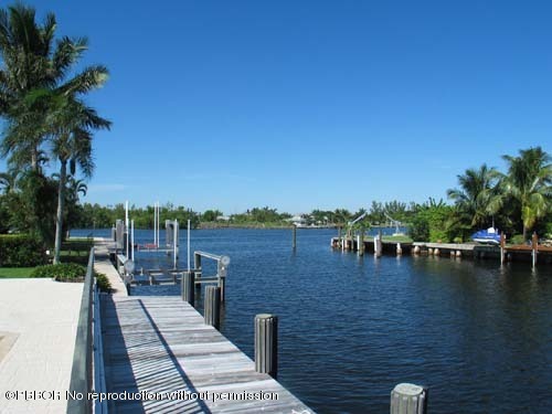10 Inlet Cay Drive Ocean Ridge, FL 33435 - Photo 2 of 9 a view of a lake with outdoor space