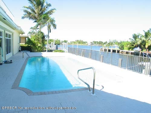10 Inlet Cay Drive Ocean Ridge, FL 33435 - Photo 3 of 9 a swimming pool with a yard