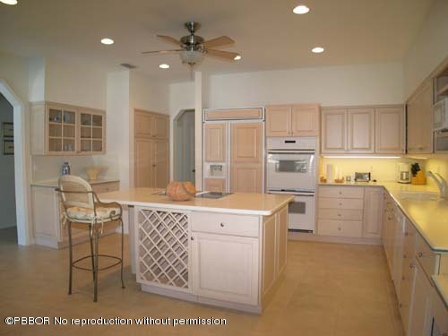 10 Inlet Cay Drive Ocean Ridge, FL 33435 - Photo 4 of 9 a kitchen with cabinets wooden floor and a view of living room