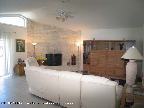 10 Inlet Cay Drive Ocean Ridge, FL 33435 - Photo 6 of 9 a room with a bed and a couch