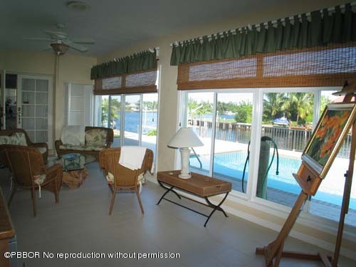 10 Inlet Cay Drive Ocean Ridge, FL 33435 - Photo 7 of 9 a living room with furniture and a large window