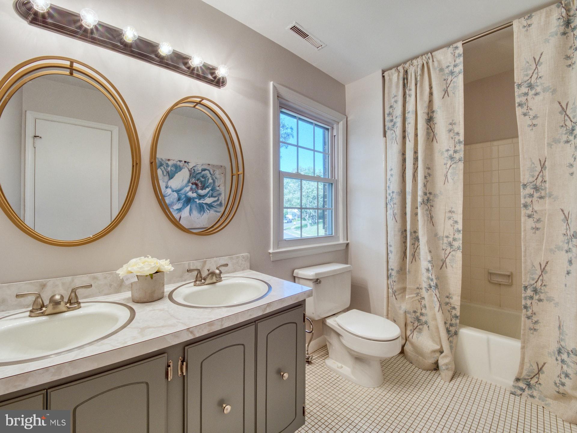 9705 Rhapsody Drive Vienna, VA 22181 - Photo 21 of 28 HALL BATHROOM WITH DOUBLE SINKS