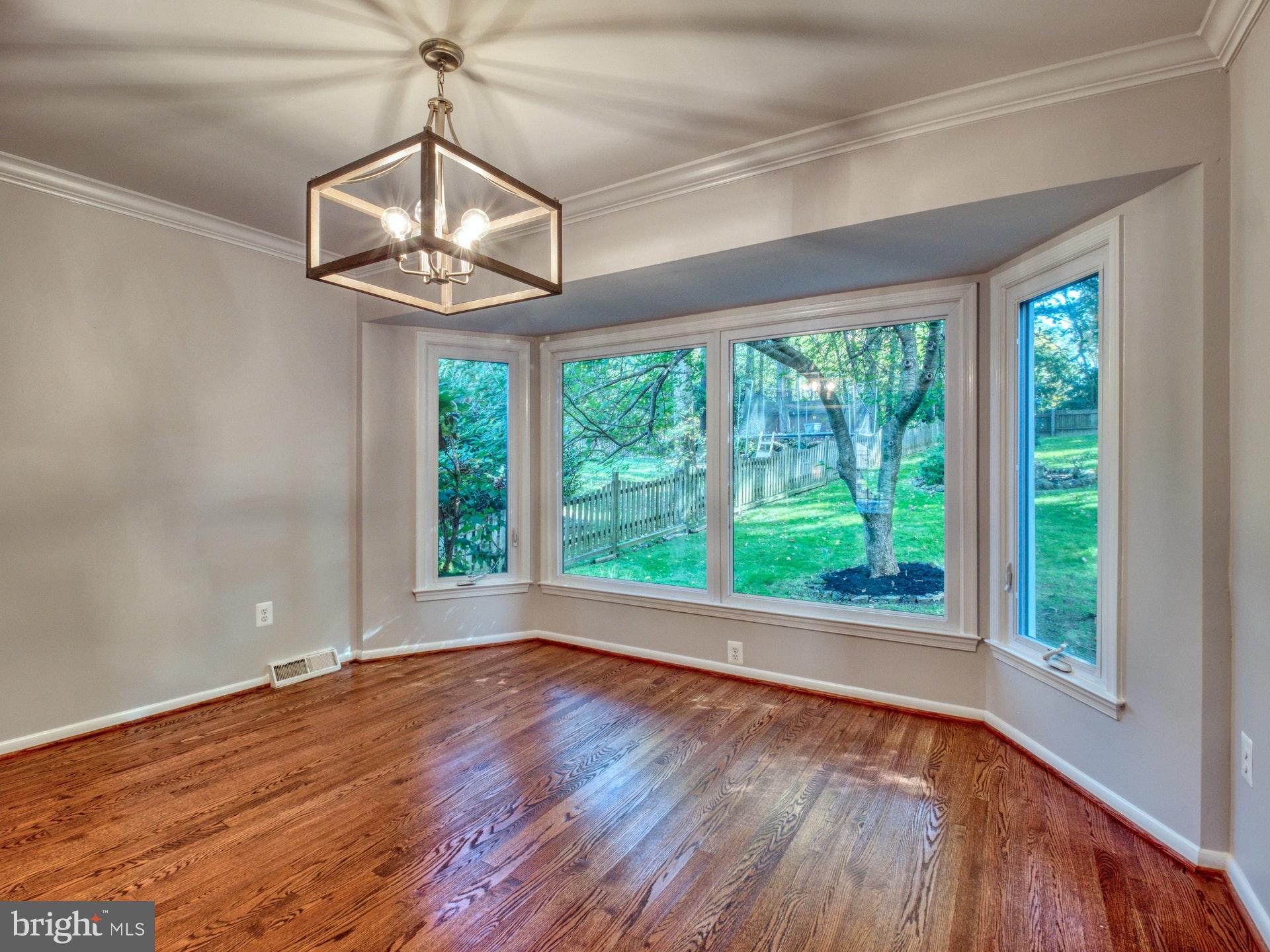 9705 Rhapsody Drive Vienna, VA 22181 - Photo 5 of 28 SEP DINING ROOM WITH WINDOW TO BACKYARD PARADISE
