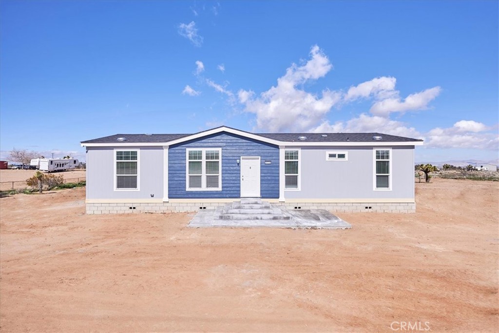 7770 Sunset Road Phelan, CA 92371 - Photo 1 of 1 a view of a yard in front of a house