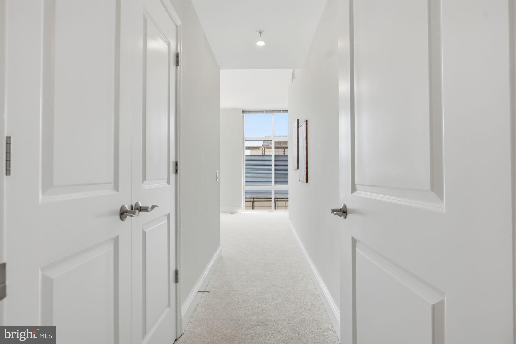 11990 Market Street, Unit 2103 Reston, VA 20190 - Photo 37 of 78 Bright and inviting hallway awaits you.