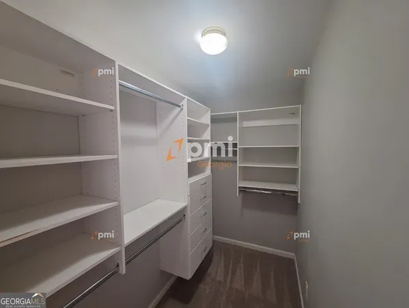 a walk in closet with a bathtub