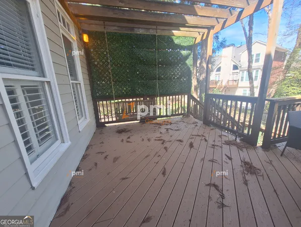 a balcony with wooden floor