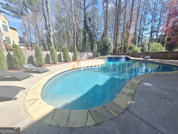 a view of a swimming pool with an outdoor space