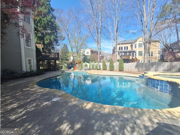 a view of a swimming pool with a patio