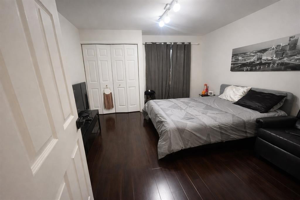 126 Laurel Road Hollywood, FL 33021 - Photo 11 of 16 a bedroom with a bed and a mirror