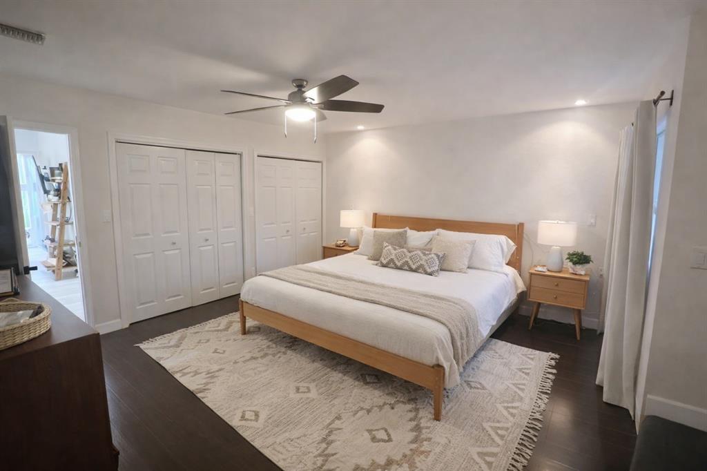 126 Laurel Road Hollywood, FL 33021 - Photo 6 of 16 a bedroom with a bed and a mirror