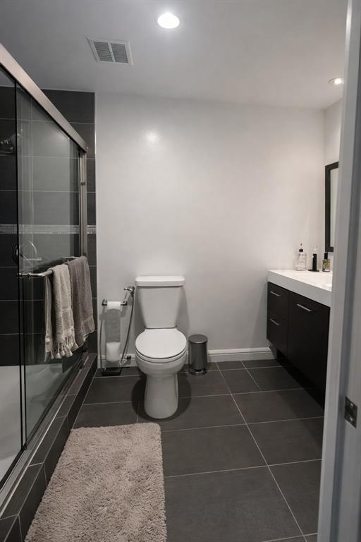 126 Laurel Road Hollywood, FL 33021 - Photo 7 of 16 a bathroom with a toilet and a shower
