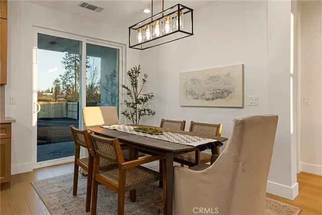 a view of a dining room with furniture and window