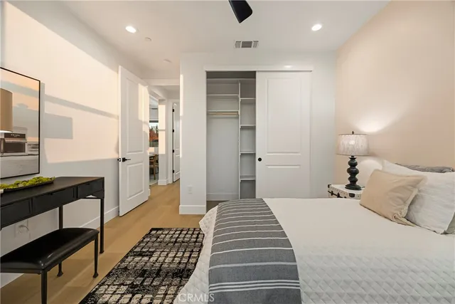 a bedroom with a bed and a walk in closet