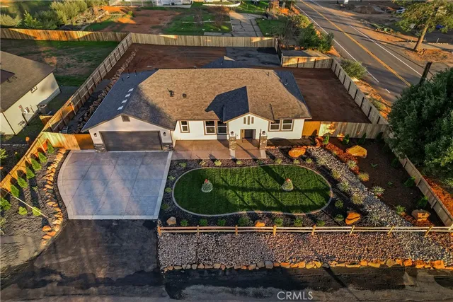 an aerial view of a house with outdoor space
