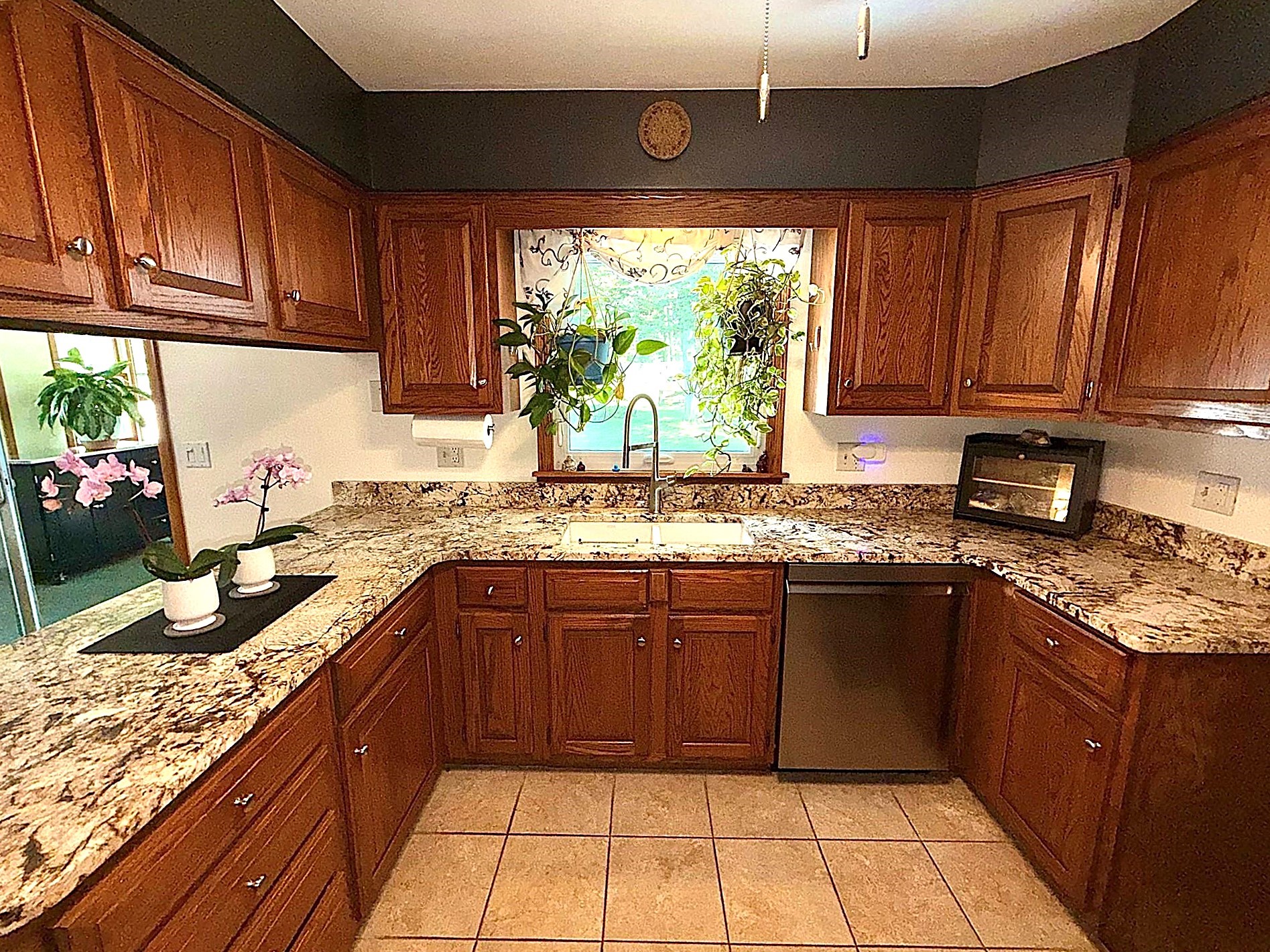8099 Edinboro Road Erie, PA 16509 - Photo 15 of 48 Lots of storage for all of your kitchen needs and it has a nice window overlooking the back yard!