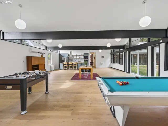a living room with patio furniture and a fireplace